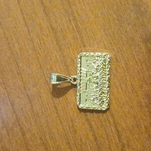 Gold Religious Pendant with Intricate Design